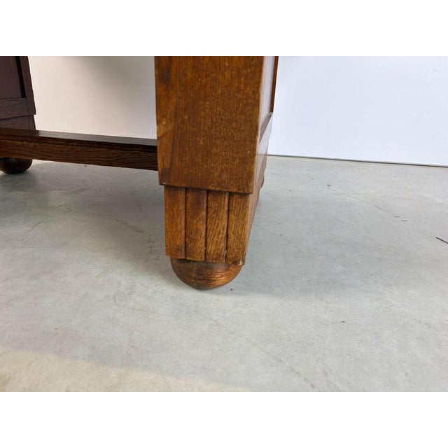 Sturdy oak marquetry inlay top dining table with carved wooden details. The top has been beautifully preserved ith...