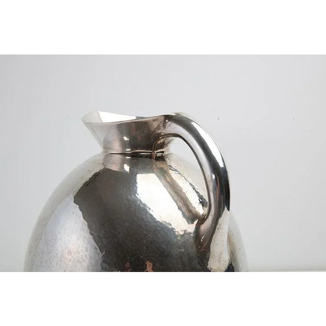 800 silver jug ​​with mertelled finish surface. Genazzi production period years40 Dimensions Diam. 18.5 - H. 22 cm This...