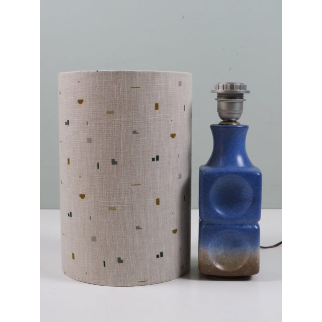 An elegant italian ceramic table lamp dating from the 1970s. the sculptural ceramic base is characterised by its beautiful...