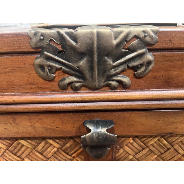 Pair of Vintage Tropical Regency chests. The wooden chests are elevated by an exquisite, heavy-duty wrought iron base...