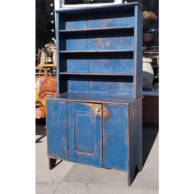 This amazing undisturbed original blue painted early 19thc step back or pewter cupboard comes to us from a forty year old...