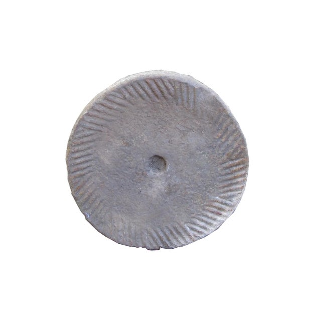 This bottom of a watermill stone was retrieved from the northern part of China. It was originally used for grinding...