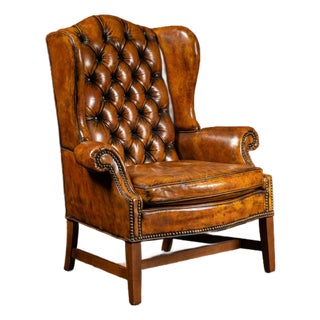 Mid 20th Century Tufted Leather Wingback Armchair in Amber For Sale