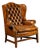 Mid 20th Century Tufted Leather Wingback Armchair in Amber For Sale