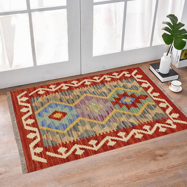 Elevate the elegance of your home with this stunning hand-woven tribal Kilim wool rug. Meticulously crafted on a loom by...