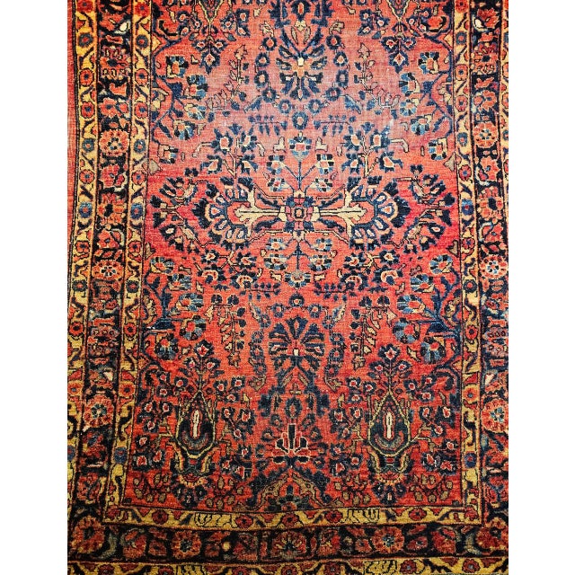 "This elegant hand-knotted Persian Sarouk rug from the first quarter of the 20th century showcases the classic allover...