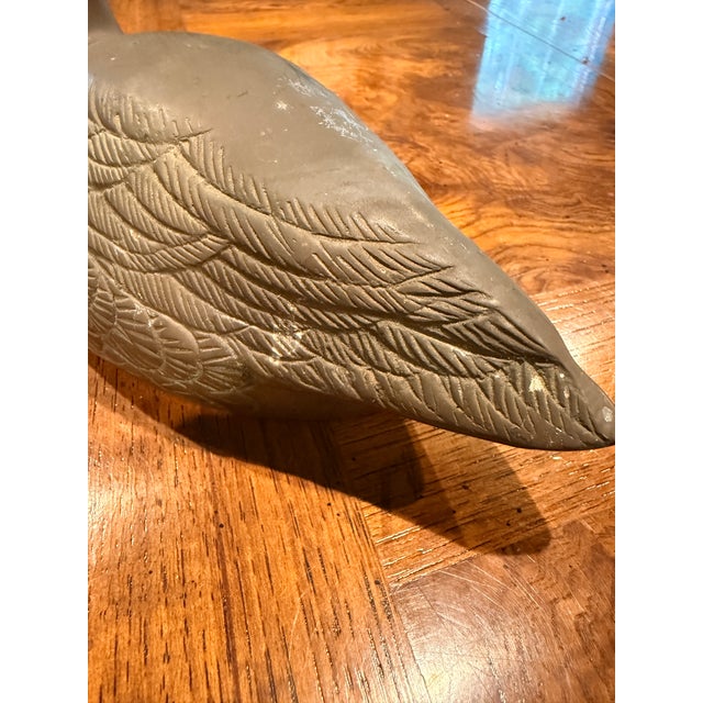 Vintage Brass Duck with detailed engravings to accent its feathers and other features.