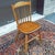 A vintage L. Hitchcock Rustic Traditional solid oak cane cut Windsor dining chair with gold stenciling on the crown of the...