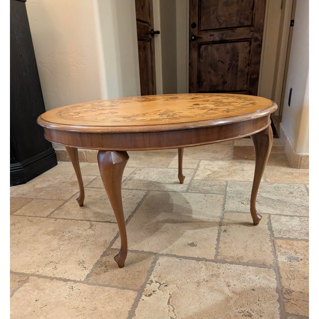 Round marquetry table featuring a marvelously detailed scene, "History of the World 1490-1590". The dates are inlaid on...