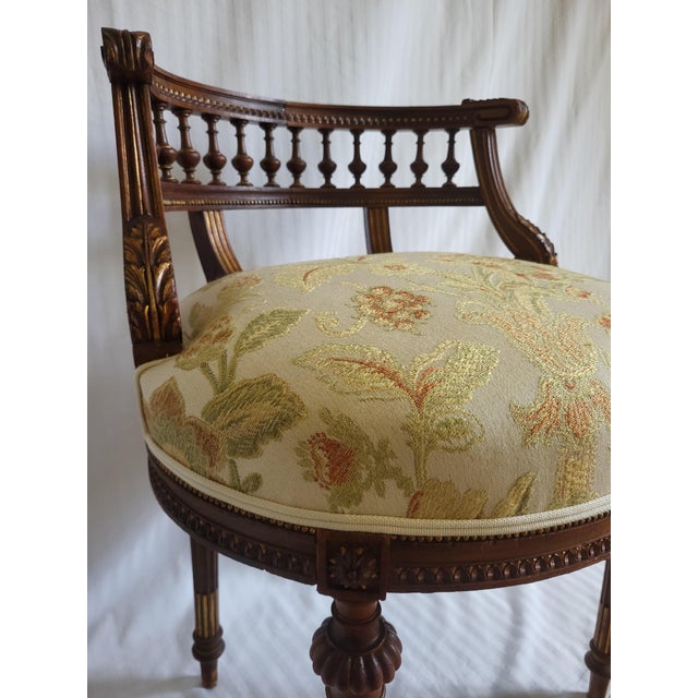 An elegant French Louis XVI style desk or vanity chair dating from the early 20th century. Crafted from solid hardwood,...