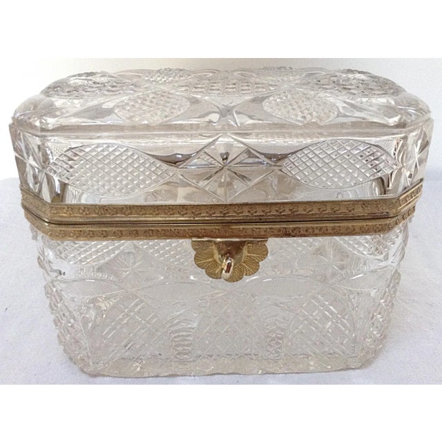 This large rare bronze mounted crystal box comes with a key. This is French and 19th Century. Has a tiny chip on the...