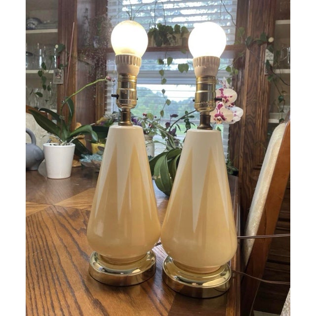 These are very cute matching boudoir glass table lamps with light yellow accents and flared skirt-like shades. Original...