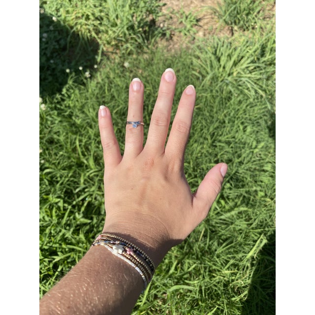 Stones: diamond, 1 round brilliant cut 4 mm approximately .20 total carats FG color/ VS2 clarity Ring Size 5.5 Rise Off Of...