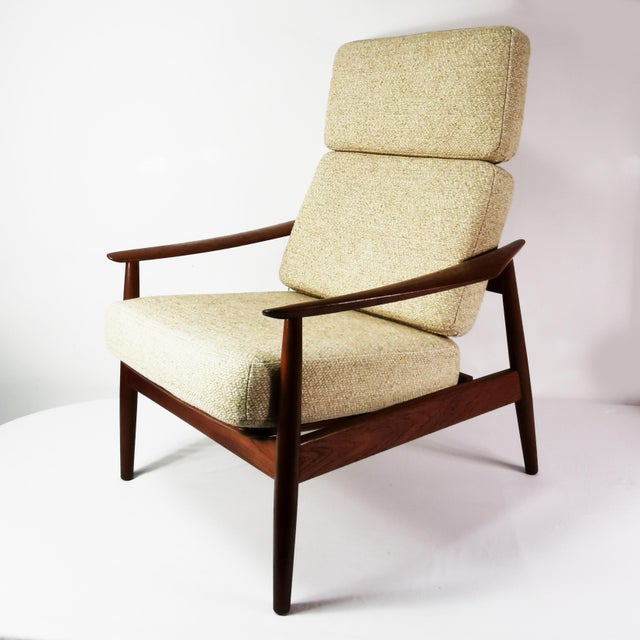 Armchair with footstool, manufactured by Cado, designed by Arne Vodder, Denmark, 1960s. It is characterized by a spacious,...
