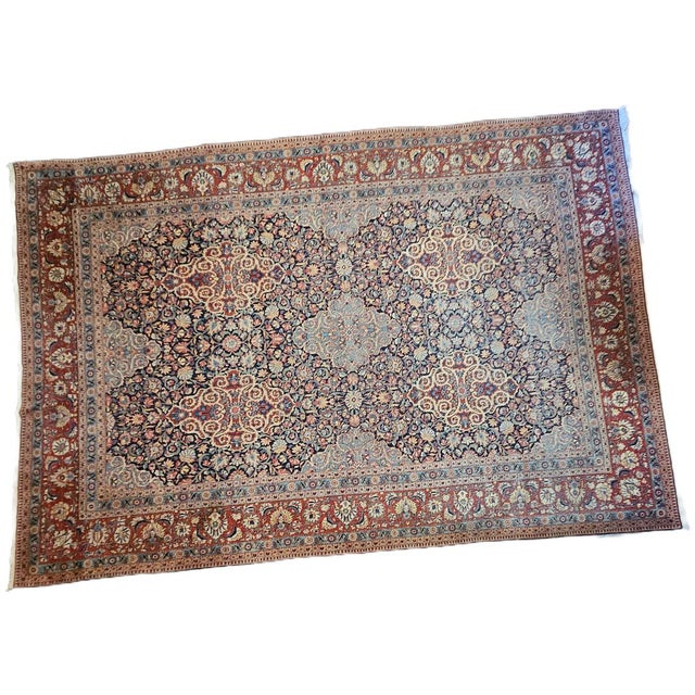 An impressive, large antique Kashan rug (359 x 248 cm), hand-knotted in wool on cotton. An elegant all-over floral...