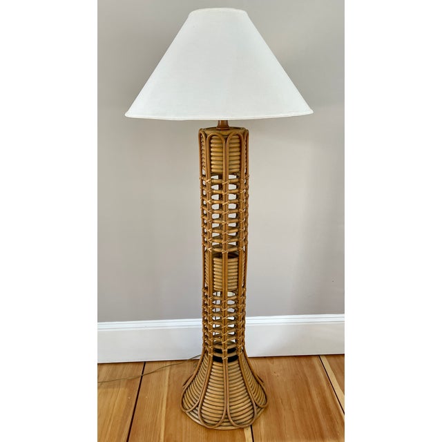Vintage mid-century rattan floor lamp in excellent condition. Original finish and original shade.