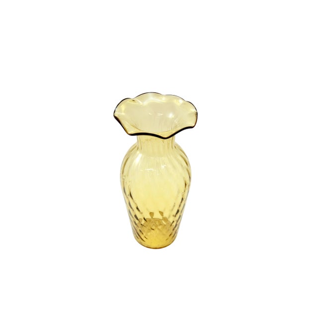 An amber golden citrine vintage optic glass vase with a flared ruffle rim. Simply a beautiful vintage addition to the...