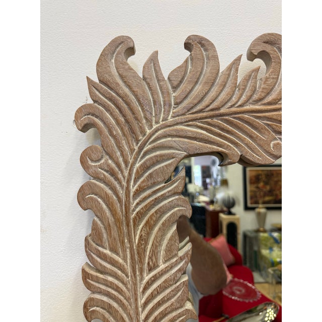 For your consideration: Extraordinary carved wood mirror with palm frond motif, some wear consistent with age. The wood...