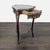 A crotch mahogany veneer and ormolu mounted occasional table, the brass bound shaped circular top above a morado veneered...