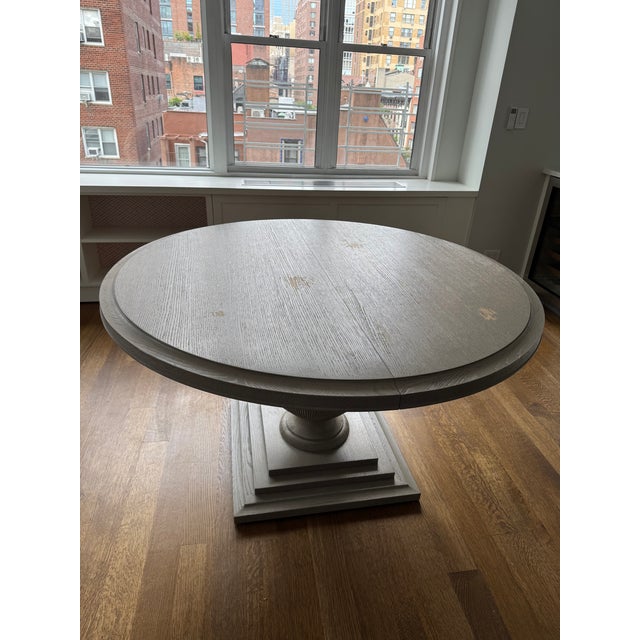 Hooker Furniture Reverie round dining table in gray painted finish. Table is 54" round and has a 16" leaf. Table also...