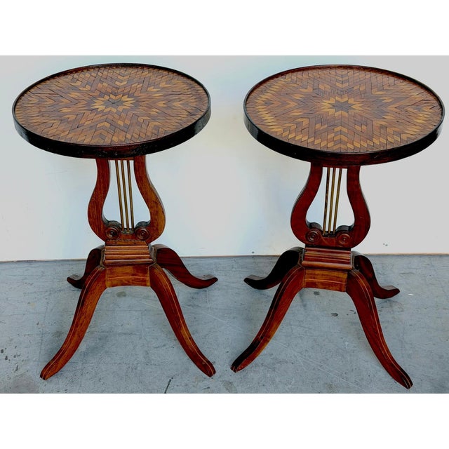 Pair of American Folk Art Inlaid Lyre-Form Tables, circa 1900 This refined and visually striking pair of American Folk Art...