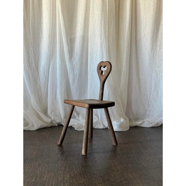 This charming vintage accent chair features a beautifully carved clover-shaped detail at the top, adding a distinctive...