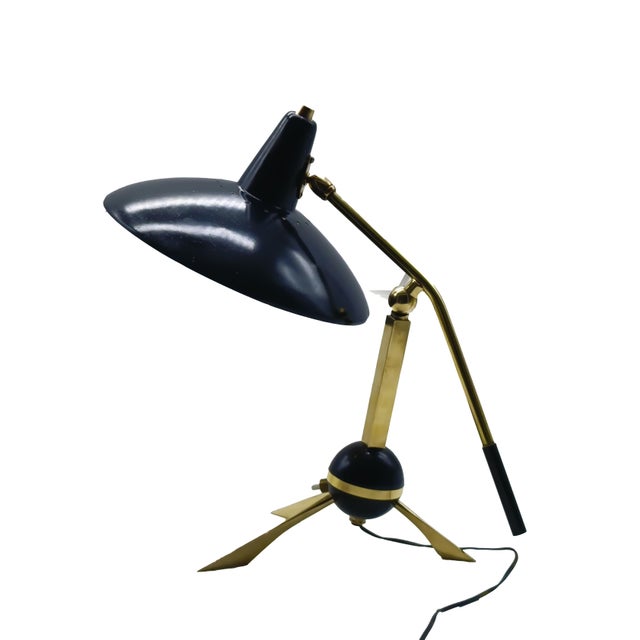 Elegant 1950s Italian table lamp by Gilardi and Barzaghi. The lamp features a base with a central sphere and three legs,...