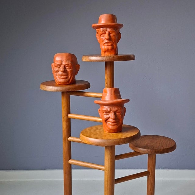 Likely, originally, this wooden stand with 4 plateaus was intended for plants. Can also be used as a display. Originating...