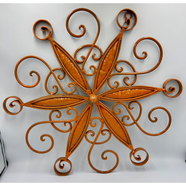 Timeless elegance and rustic charm to your living space with this beautiful French Country Wrought Iron Orange Starburst...