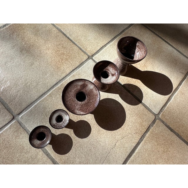 This set of five different, handcrafted ceramic candlesticks from the Serocka workshop impresses with its diverse design,...