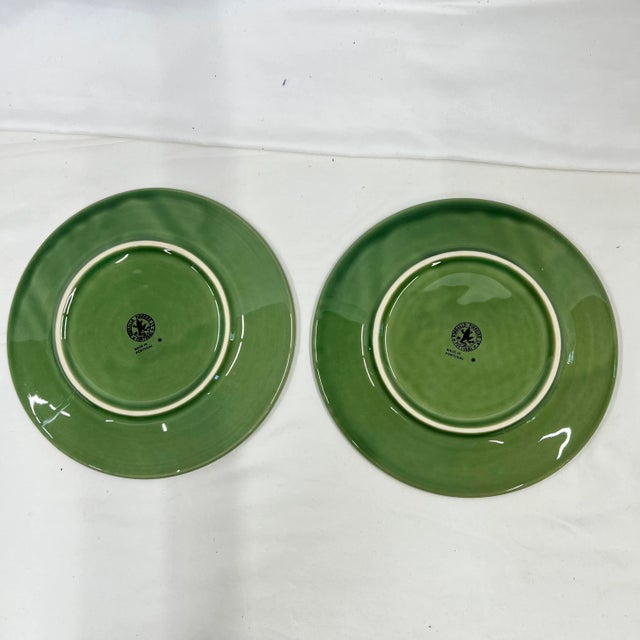 A pair of 8” Bordallo Pinherio pineapple plates in green. Marked appropriately.