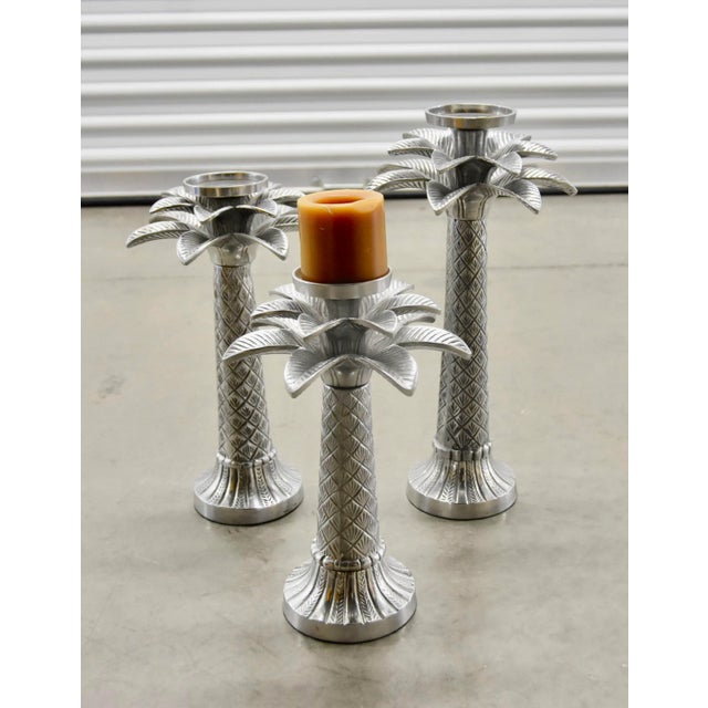 Beauty And A Warm Glow To Your Design With these Holland Boone Palm Tree Candlesticks. Crafted In pewter With A Polished...