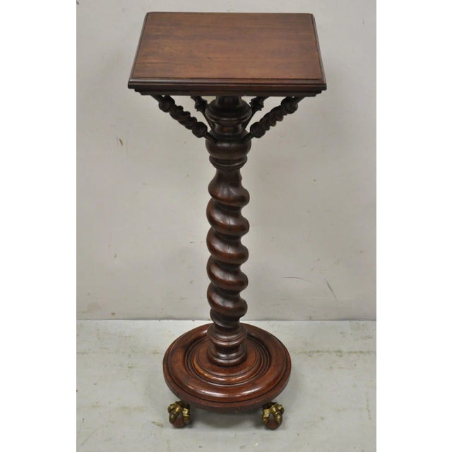 Antique Empire Victorian Walnut Barley Twist Spiral Carved Pedestal Stand. Item features brass claw feet with wooden...