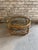 Mid-Century Italian two-tier round coffee table made of curved bamboo, rattan and hand-woven wicker with a glass top....
