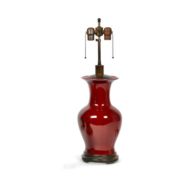 This is a classic pair of late 19th century Sang de Boeuf (Oxblood) Chinese Export Vases that have been fitted with a...