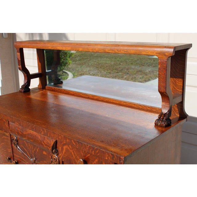 Wood Antique Victorian Quarter-Sawn Tiger Oak Buffet Sideboard With Beveled Mirror and Lion Paw Feet on Casters For Sale - Image 7 of 18