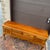 A vintage Statton Queen Anne solid cherry sideboard or buffet having two locking cabinets with three dovetailed drawers in...