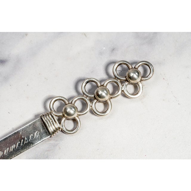 This handsome handmade solid sterling silver letter opener combines substantial craftsmanship with a wonderfully...