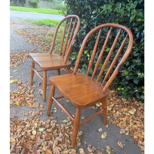 Vintage Windsor Wooden Spindle Back Chairs – Pair A charming pair of vintage Windsor spindle back chairs, featuring...