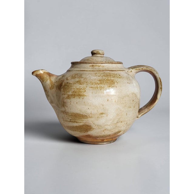 Glazed Stoneware Teapot – Hervé Rousseau, Boisbelle Workshop, La Borne This stoneware teapot, with its curved shape, was...