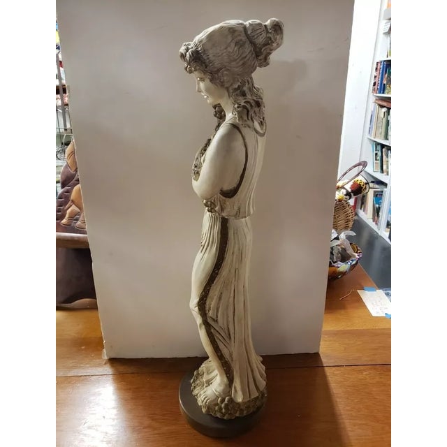 This is Mid 20th Century Art Nouveau Woman with Grapes Chalkware/Resin Sculpture. It measures 27" high and 7“ in diameter...