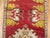 A narrow vintage turkish runner in predominant bright cherry red. 1'6'' x 10'3''