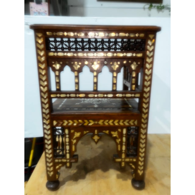 This exceptional corner chair showcases the rich tradition of Syrian craftsmanship, featuring intricate hand-cut mother-...