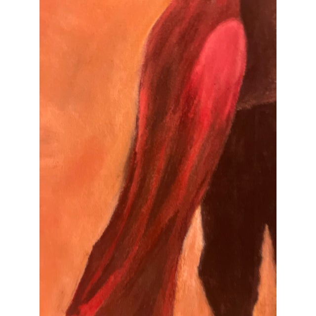 Two dancers lean into a tango embrace, her red gown sweeping the floor and his dark suit melting into a glowing terracotta...