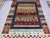 This Afghan Sultani natural dye wool rug features a colorful Khorjin saddlebag-inspired design with horizontal bands of...