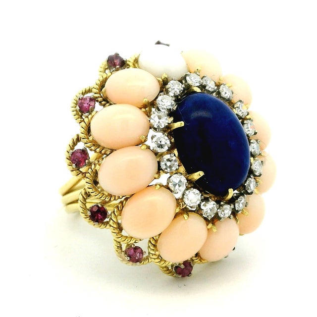 AnItalian cocktail ring crafted in 18-karat yellow gold, dating to the 1970s. This beautifully constructed statement ring...