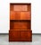 Functional bookshelf in teak. Bottom section offers sliding doors with solid teak handles. The above bookshelf storage...