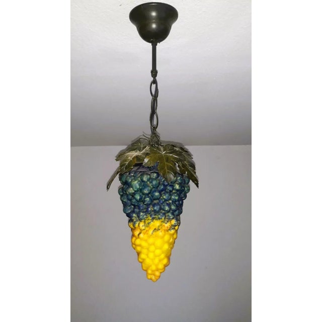 "Grape Lamp" Object: Pendant lamp 1-bulb E14 Age: Approx. 1970s/80s Material: Metal, glass Dimensions: Height with chain...