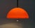Rare train pendant lamp of Harvey Guzzini. The large plastic screen is executed in orange. On the inside of the screen is...