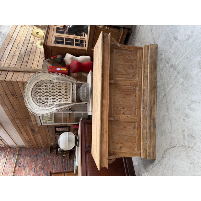 This antique fir wood trading counter has been fully restored. It consists of a front panel, side panels, and a top made...